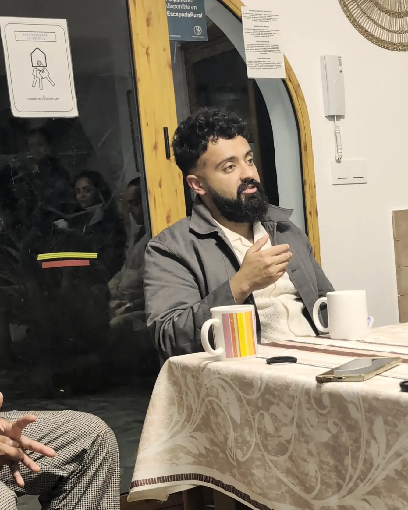 Sukh at the head of the table in the evening, the group round it